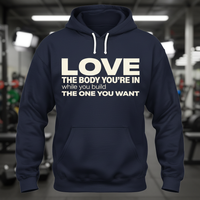 Load image into Gallery viewer, Love the Body You’re In While You Build the One You Want Hoodie – Women’s Gym Motivation Sweatshirt